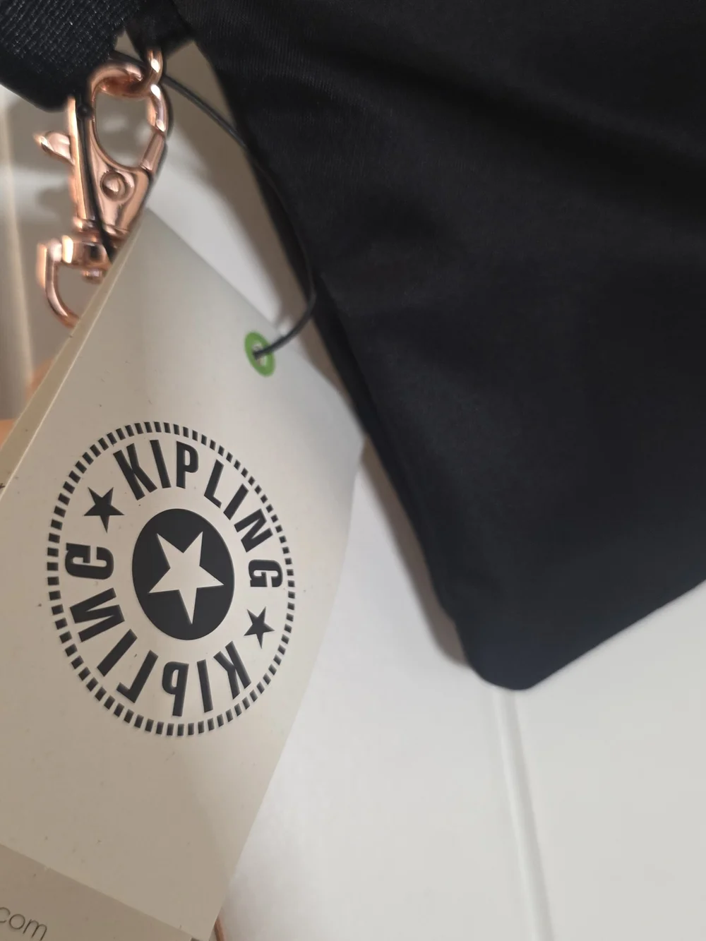 Kipling Black Crossbody with Rose Gold Hardware and Tan Tassel